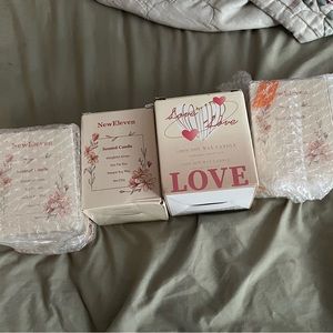 4 candles new in boxes